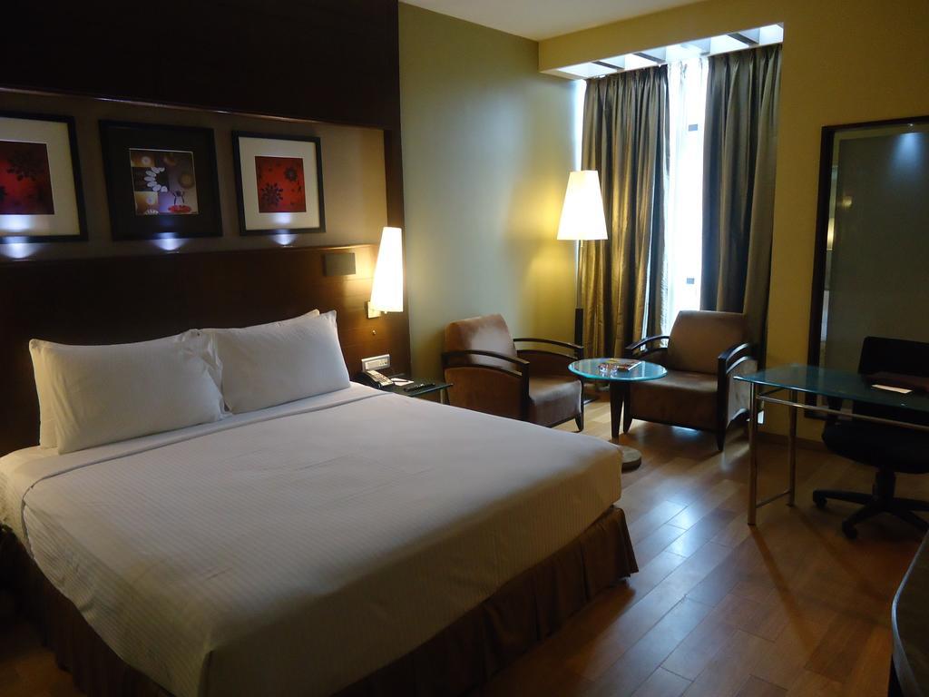 Radisson Blu Atria Bengaluru Hotel Exterior photo A room at the hotel