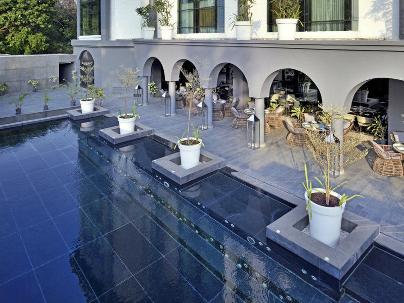Radisson Blu Atria Bengaluru Hotel Exterior photo The pool at the home of Michael and Diane Rockefeller