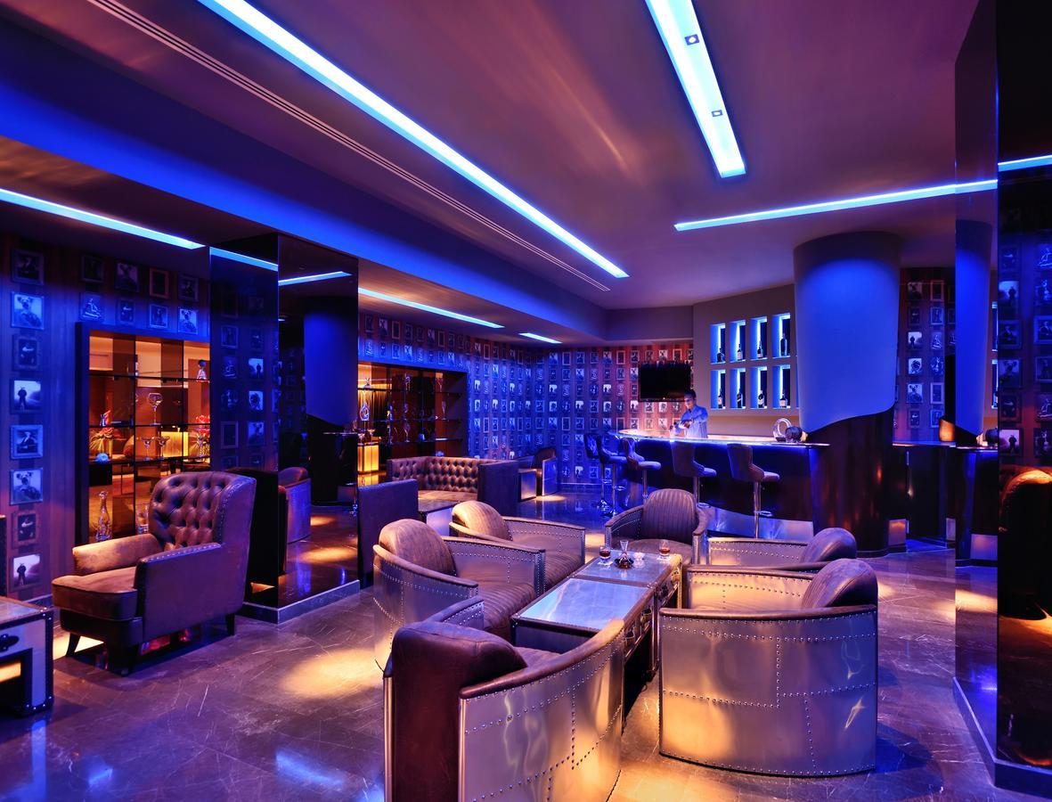 Radisson Blu Atria Bengaluru Hotel Exterior photo The lounge at the airport