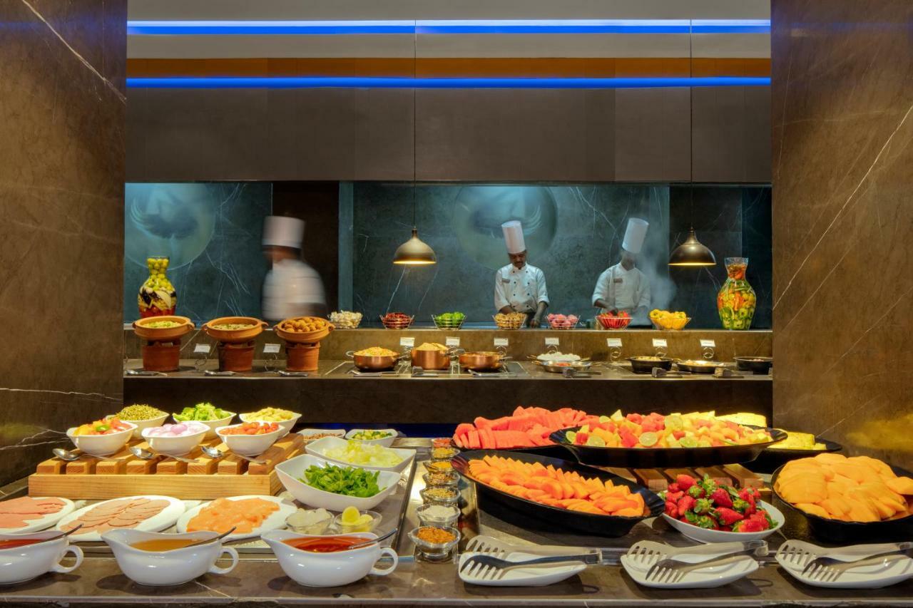 Radisson Blu Atria Bengaluru Hotel Exterior photo A buffet at a hotel