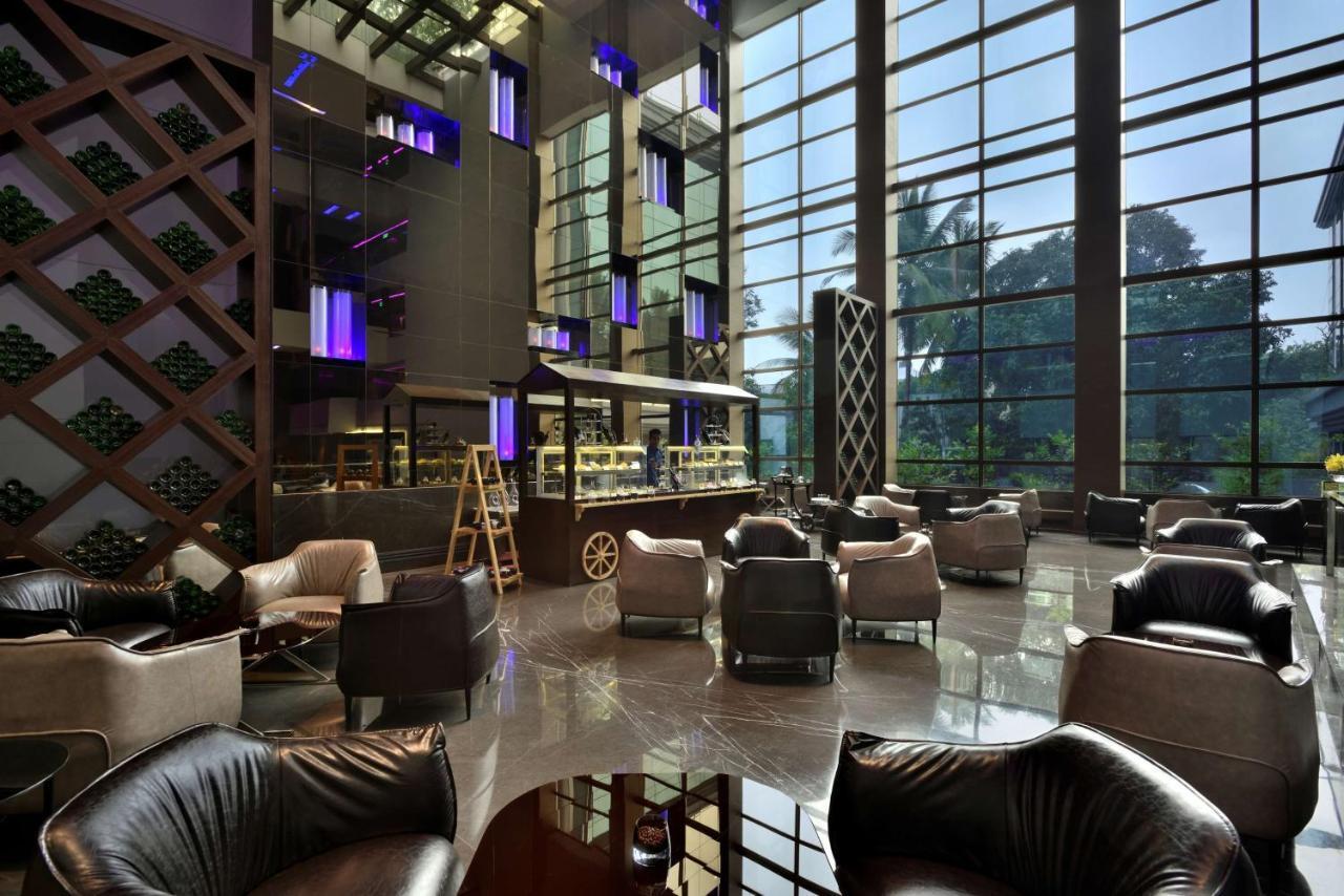 Radisson Blu Atria Bengaluru Hotel Exterior photo The lounge at the airport